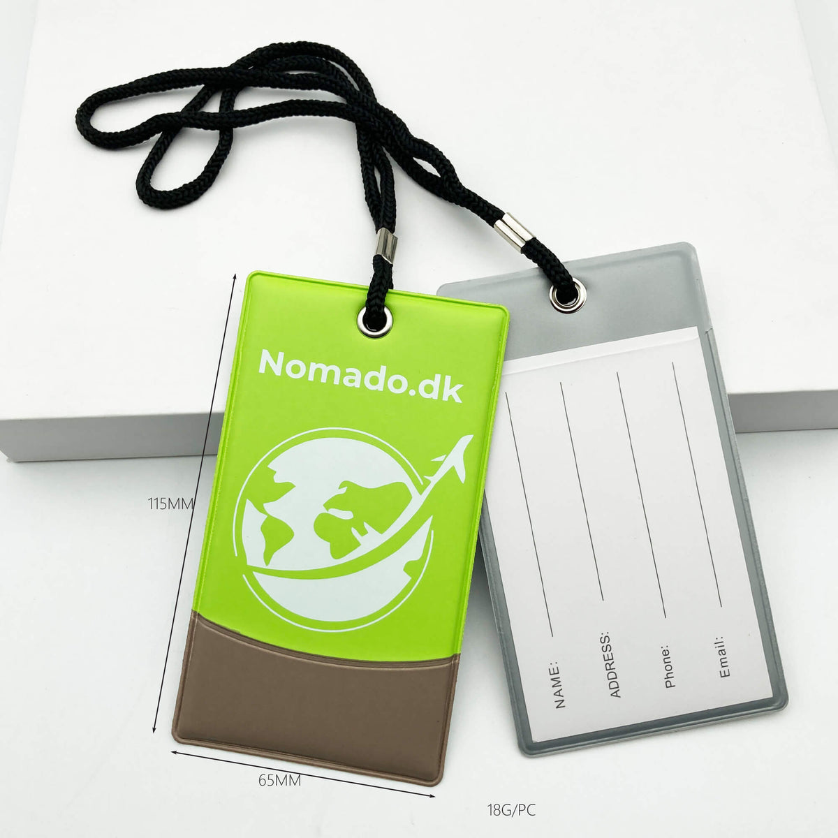 Green Nomado luggage tag with logo and a white tag for contact information